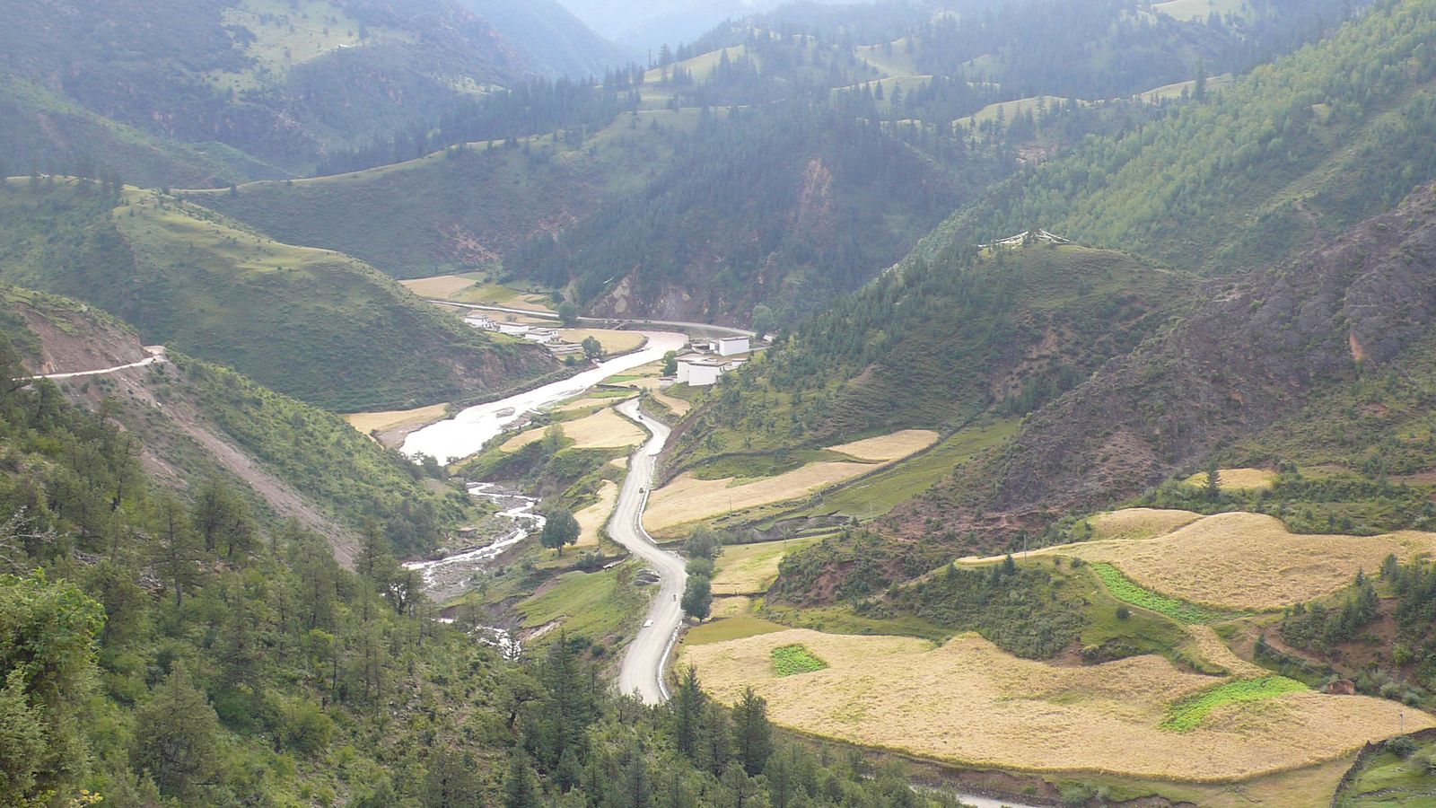 A river valley with terraced fields in Markam, Chamdo