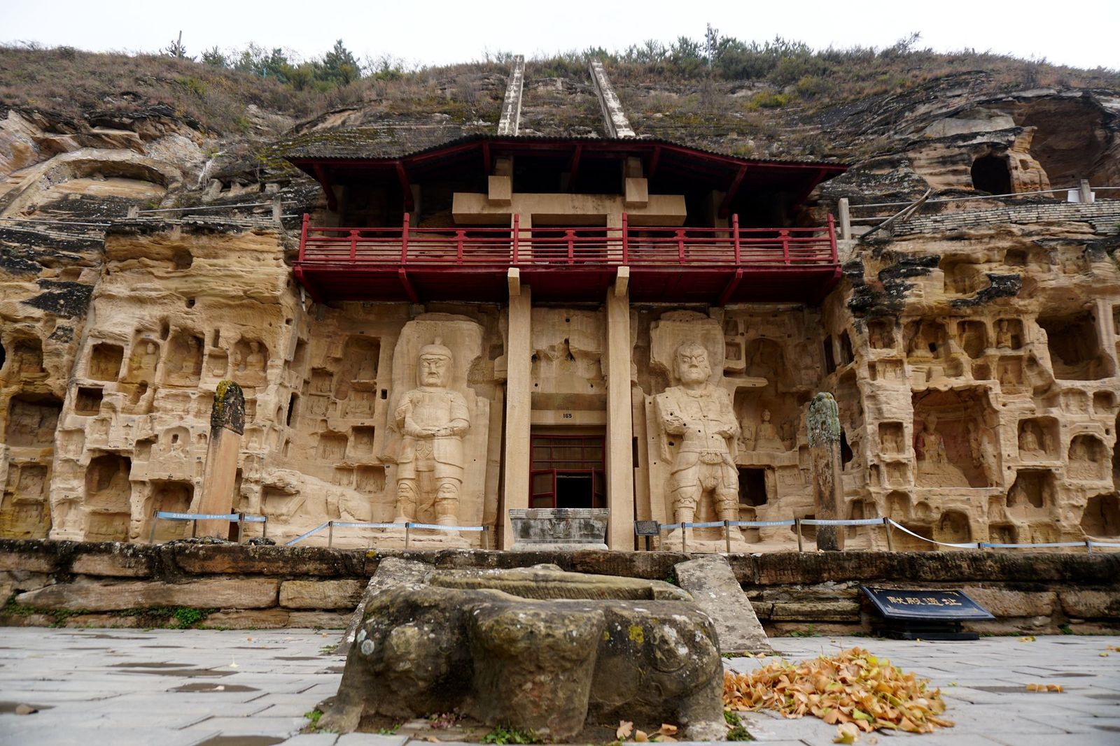 The carved cliff facade of the Beishi Grottoes near Qingyang