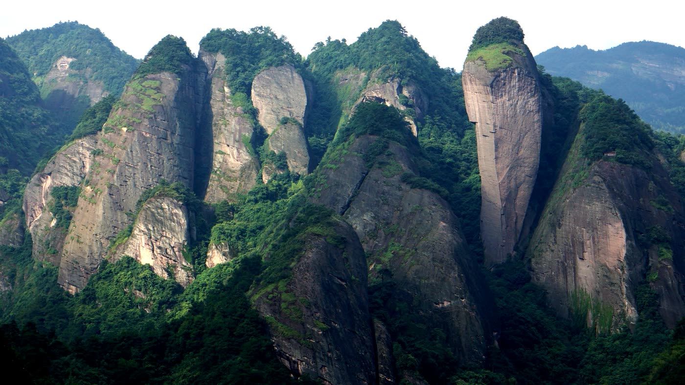 The sandstone towers of Mount Lang rising above forest