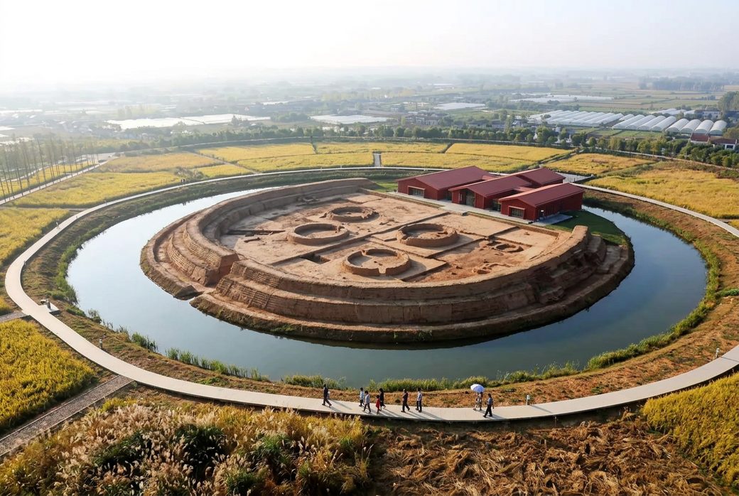 Chengtoushan site Neolithic walled settlement exposed earth moat and house foundations with a museum building Hunan