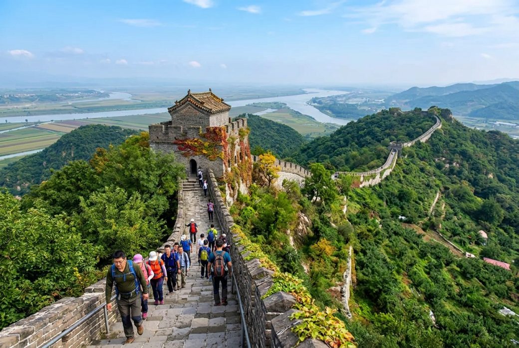 Hikers climbing the Hushan Great Wall steps with view across the Yalu River