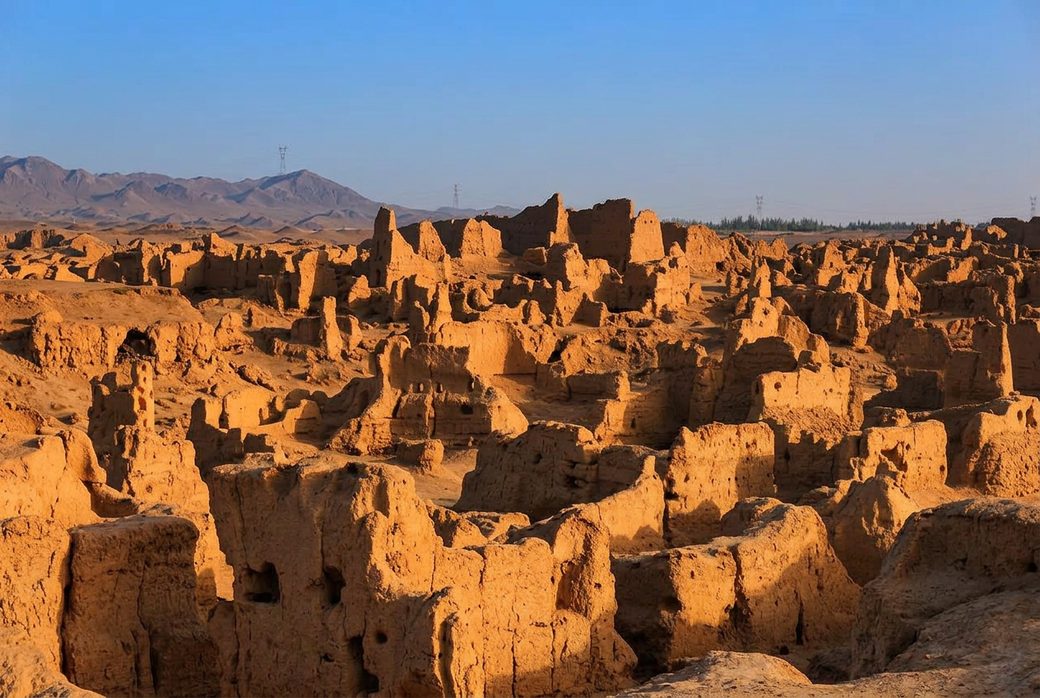 Gaochang Ruins thick earthen walls of an ancient Silk Road city and ruined monastery under blue sky Turpan