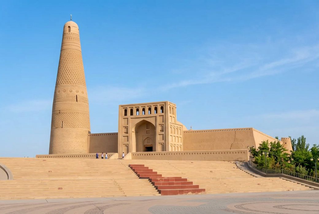 Emin Minaret tall brick tower with decorative patterns beside a mosque Turpan Uyghur architecture