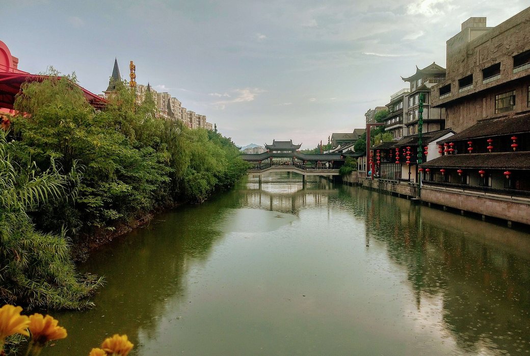 Canal lined with Song-style buildings at Hangzhou Songcheng