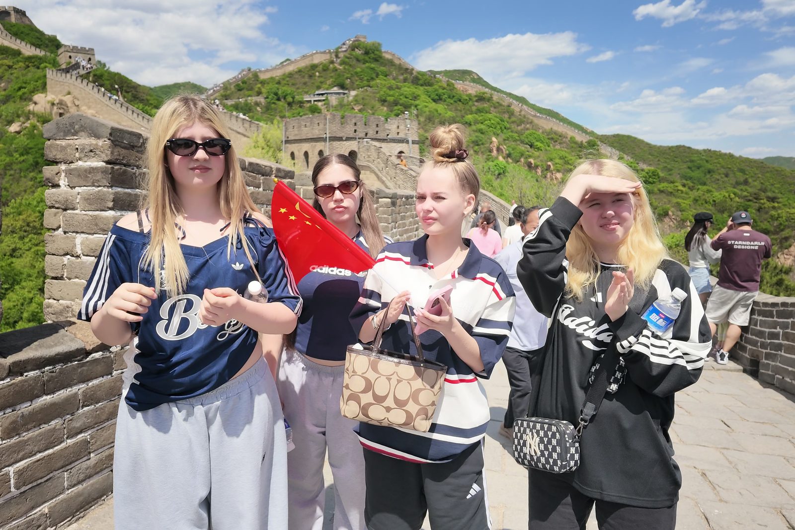 Students posing together on a restored section of the Great Wall near Beijing