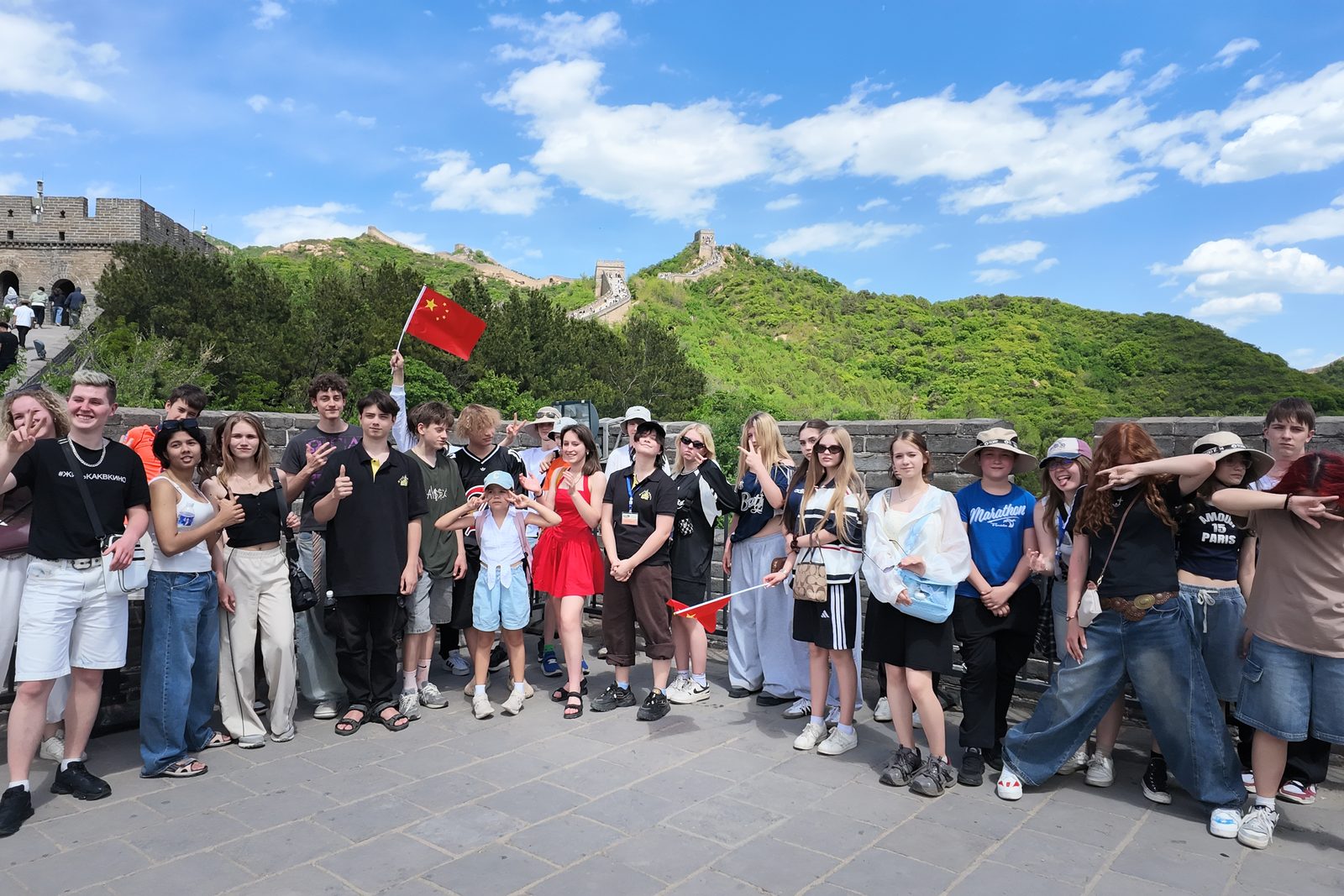 The student group with Chinese flags on the Great Wall near Beijing