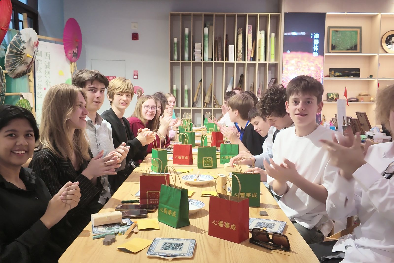Students around a long table at a heritage craft workshop in Hangzhou